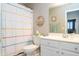 Cozy bathroom with a toilet, sink and mirror and nice decor and accents at 2224 W Olive Way, Chandler, AZ 85248