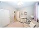 Bedroom with wood-look tile flooring, neutral walls, closet and changing table at 2224 W Olive Way, Chandler, AZ 85248