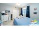Bright bedroom features tiled floor, ceiling fan, big closet and a large window at 2224 W Olive Way, Chandler, AZ 85248