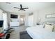 Spacious main bedroom features connecting ensuite and a chest of drawers with decor at 2224 W Olive Way, Chandler, AZ 85248