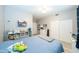 Bright bedroom with a ceiling fan, big closet, and cute decor and furniture at 2224 W Olive Way, Chandler, AZ 85248