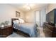 Comfortable bedroom featuring a queen-sized bed, neutral decor, and plenty of natural light at 2224 W Olive Way, Chandler, AZ 85248