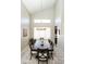 Dining room featuring wood floors, a modern chandelier, and plentiful natural light at 2224 W Olive Way, Chandler, AZ 85248