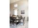 Formal dining room showcases a large table with seating for eight under an elegant chandelier at 2224 W Olive Way, Chandler, AZ 85248