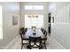 Dining room featuring wood floors, a modern chandelier, and plentiful natural light at 2224 W Olive Way, Chandler, AZ 85248