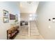 Inviting entryway with stylish décor, a staircase, and access to multiple living spaces at 2224 W Olive Way, Chandler, AZ 85248