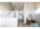 Bright foyer showcases high ceilings, a modern chandelier, and an open staircase at 2224 W Olive Way, Chandler, AZ 85248