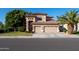 Inviting two-story home featuring a two-car garage, manicured lawn, and desert landscaping at 2224 W Olive Way, Chandler, AZ 85248