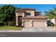 Inviting two-story home featuring a two-car garage, manicured lawn, and desert landscaping at 2224 W Olive Way, Chandler, AZ 85248