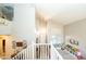 Upstairs hallway offers views of playroom and home entrance, bright natural light at 2224 W Olive Way, Chandler, AZ 85248
