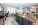 Gourmet kitchen features stainless steel appliances, granite countertops, and an adjacent dining area at 2224 W Olive Way, Chandler, AZ 85248