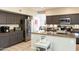 Stylish kitchen featuring modern appliances, granite counters, and ample cabinet space for storage at 2224 W Olive Way, Chandler, AZ 85248