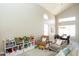 Bright open-concept living area with high ceilings and views into the dining area at 2224 W Olive Way, Chandler, AZ 85248