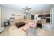 Spacious living room boasts an L-shaped sofa and connects seamlessly to the kitchen at 2224 W Olive Way, Chandler, AZ 85248