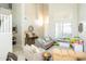 Spacious living room with high ceilings, modern furnishings, and a cozy atmosphere at 2224 W Olive Way, Chandler, AZ 85248