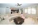 Bright living room with a large sectional sofa, open to the kitchen and bathed in natural light at 2224 W Olive Way, Chandler, AZ 85248