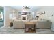 Open-concept living room with comfortable seating, a fireplace, and natural light at 2224 W Olive Way, Chandler, AZ 85248