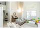 Bright living room with high ceilings, stylish decor, and plenty of space for comfortable living at 2224 W Olive Way, Chandler, AZ 85248