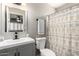 Bathroom featuring modern vanity, and shower with curtain at 2302 E Monte Cristo Ave, Phoenix, AZ 85022