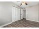Bedroom featuring wood-look floors, a closet, and attached bathroom at 2302 E Monte Cristo Ave, Phoenix, AZ 85022