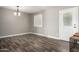 Well-lit dining room featuring laminate floors and a door to the backyard at 2302 E Monte Cristo Ave, Phoenix, AZ 85022