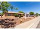 Single story home with desert landscaping featuring a stucco exterior, rock ground cover, and mature trees at 2302 E Monte Cristo Ave, Phoenix, AZ 85022