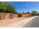 Property featuring a gated entryway, desert landscaping, and a stucco wall for added privacy at 2302 E Monte Cristo Ave, Phoenix, AZ 85022