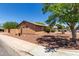 Single story home featuring desert landscaping, a stucco exterior, and a mix of rock and plant ground cover at 2302 E Monte Cristo Ave, Phoenix, AZ 85022