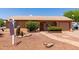 Charming single-story home featuring desert landscaping, a brick walkway, and an attached garage at 2302 E Monte Cristo Ave, Phoenix, AZ 85022