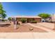 Charming single-story home featuring desert landscaping, a brick walkway, and an attached garage at 2302 E Monte Cristo Ave, Phoenix, AZ 85022
