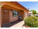 Home exterior with brick entry and shade plants and view of the garage at 2302 E Monte Cristo Ave, Phoenix, AZ 85022