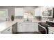 Bright kitchen with white cabinetry and stainless steel appliances at 2302 E Monte Cristo Ave, Phoenix, AZ 85022