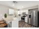Bright kitchen with white cabinetry, stainless steel appliances, and modern fixtures at 2302 E Monte Cristo Ave, Phoenix, AZ 85022