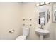 Cozy bathroom features sleek fixtures, toilet, and a round mirror above the sink at 2401 E Rio Salado Pkwy # 1055, Tempe, AZ 85288
