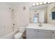 Bright bathroom features a shower-tub combo and a single sink vanity with a mirror at 2401 E Rio Salado Pkwy # 1055, Tempe, AZ 85288