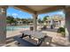Enjoy the community pool with a picnic table, shaded areas, and comfortable lounge chairs at 2401 E Rio Salado Pkwy # 1055, Tempe, AZ 85288