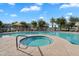 Relax in the community with a large pool, hot tub, and sundeck area under a clear blue sky at 2401 E Rio Salado Pkwy # 1055, Tempe, AZ 85288
