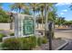 Beautiful Villagio community entrance featuring lush landscaping, a neighborhood map, and mature palm trees at 2401 E Rio Salado Pkwy # 1055, Tempe, AZ 85288