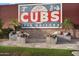 The CUBS mural and floral display add a touch of charm to the entrance at 2401 E Rio Salado Pkwy # 1055, Tempe, AZ 85288
