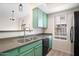 The kitchen is complete with stainless steel sink and black appliances at 2401 E Rio Salado Pkwy # 1055, Tempe, AZ 85288