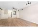Open floor plan featuring a spacious living area with wood flooring and modern lighting at 2401 E Rio Salado Pkwy # 1055, Tempe, AZ 85288