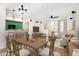A bright living room with a dining table, kitchen bar, and a staircase at 2401 E Rio Salado Pkwy # 1055, Tempe, AZ 85288