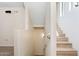 Bright staircase with neutral paint and light wood-style flooring leads downstairs at 2401 E Rio Salado Pkwy # 1055, Tempe, AZ 85288