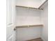 Spacious walk-in closet features wood rods, shelving, and neutral walls at 2401 E Rio Salado Pkwy # 1055, Tempe, AZ 85288