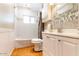 Updated bathroom with subway tile, modern vanity, and shower-tub combination at 2715 E Edgemont Ave, Phoenix, AZ 85008