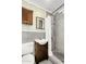 Modern bathroom with gray tile, mosaic accents, stylish shower fixtures, and a dark wood vanity at 2715 E Edgemont Ave, Phoenix, AZ 85008