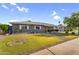 Well-maintained single-story home featuring xeriscaped front yard with lush, green, artificial lawn at 2715 E Edgemont Ave, Phoenix, AZ 85008