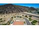The homes feature desert landscaping, tile roofs, and attached garages in this desert community with mountain views at 3028 W Parkside Ln, Phoenix, AZ 85027