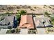 Single-story home boasts desert landscaping, a tile roof, and an attached two-car garage, nestled in a desert community at 3028 W Parkside Ln, Phoenix, AZ 85027