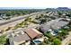 An aerial glimpse of lush backyard pools and green spaces nestled within a beautiful residential neighborhood, perfect for relaxation at 3028 W Parkside Ln, Phoenix, AZ 85027
